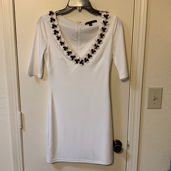 Sheri Bodell Dresses & Skirts - Sheri Bodell Size Small White Dress with Black Gemstones Neckline Trim